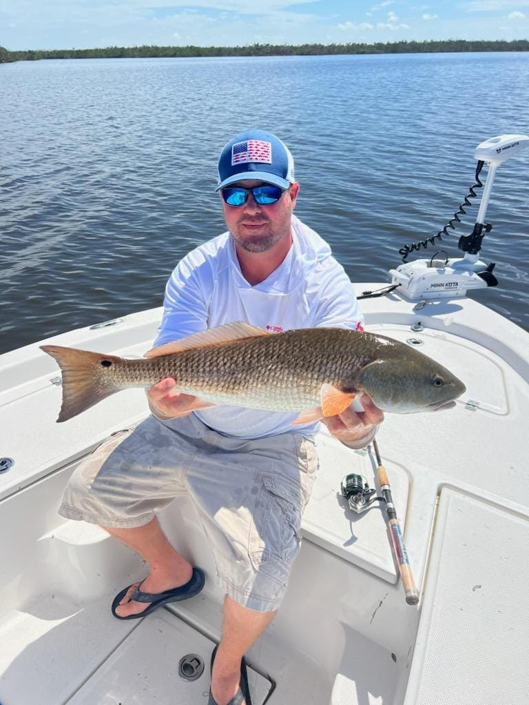 man holding a fish